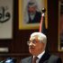 Mahmoud Abbas, presidente da ANP e l&iacute;der de Al Fatah. Ao fondo, un retrato de Yasser Arafat